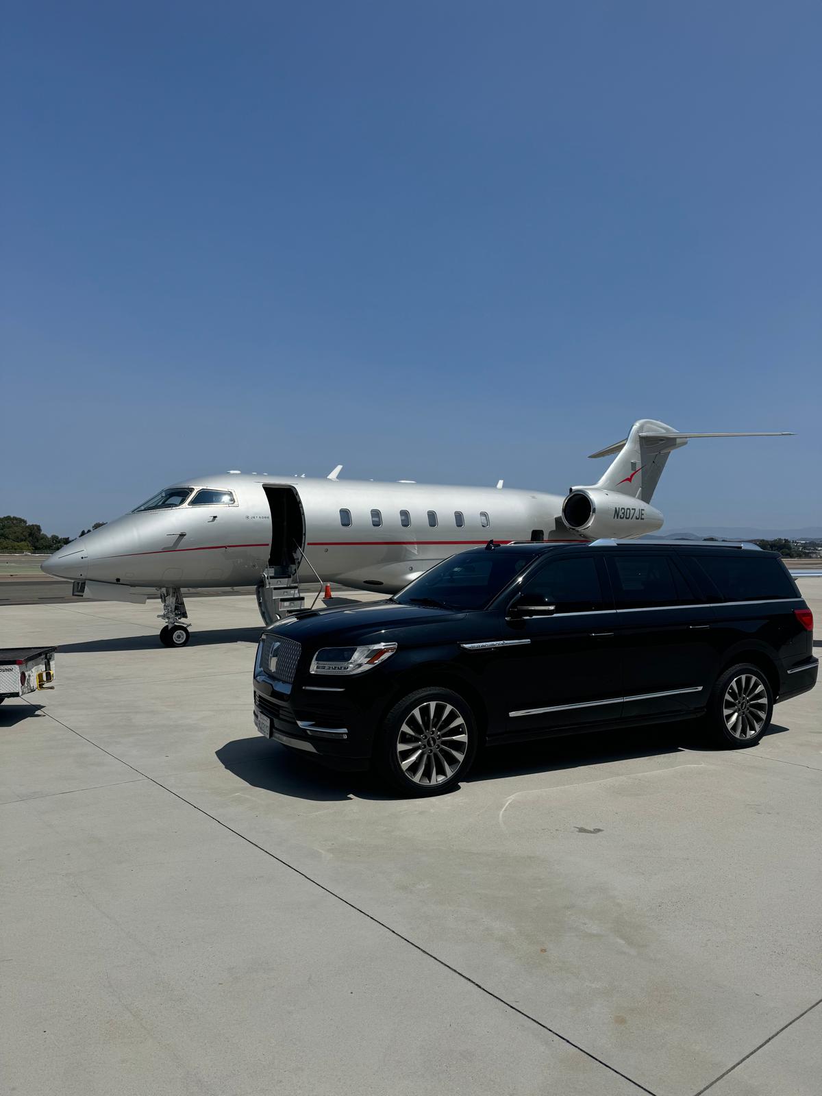 Airplane wing above the clouds for a Woodside airport chauffeur journey